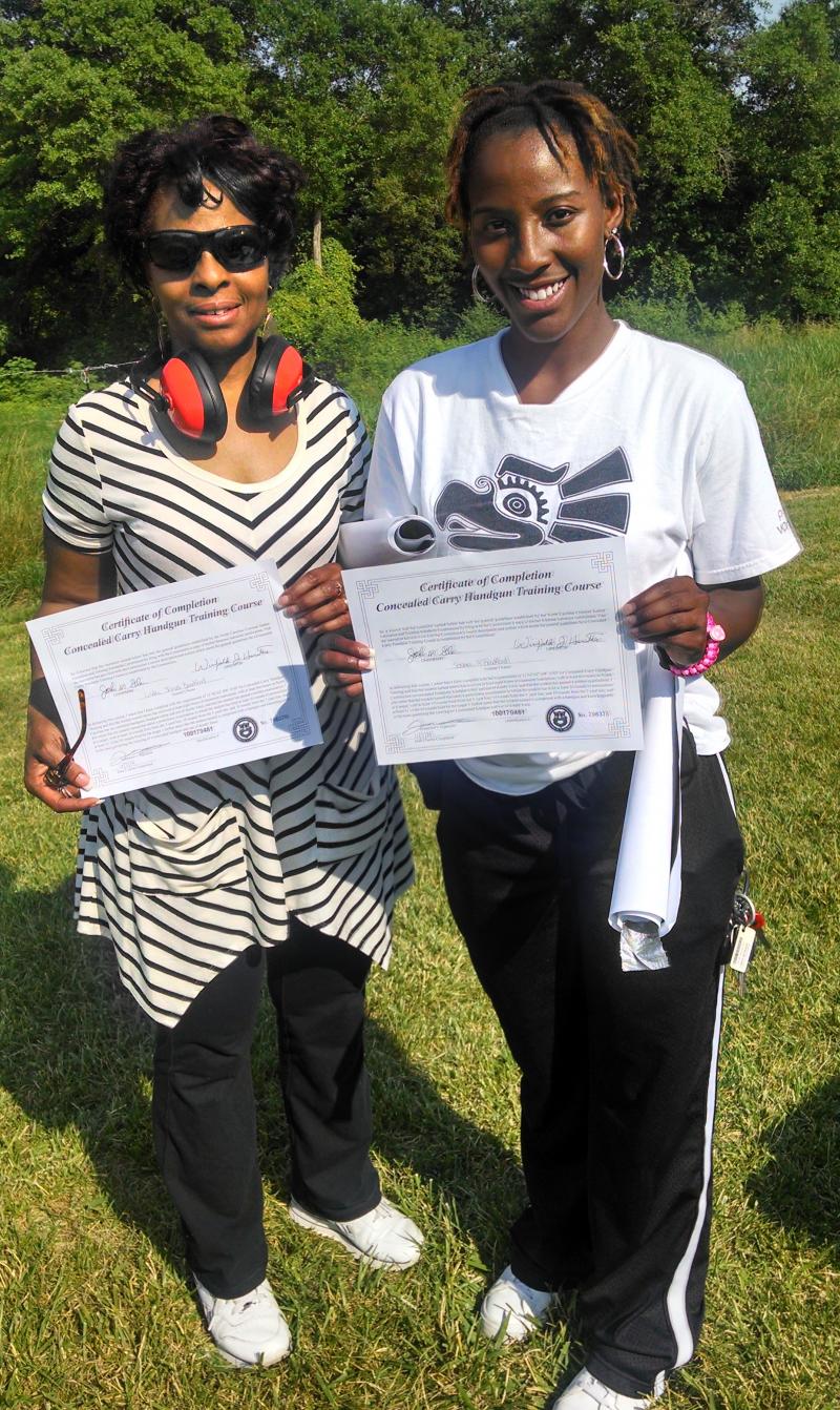 Linda & Sosha received their Certificates after shooting at the range. Good job